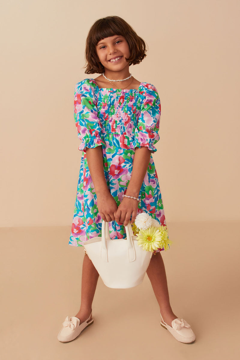 GY8043 Green Mix Girls Vivid Floral Smocked Long Sleeve Dress Pose