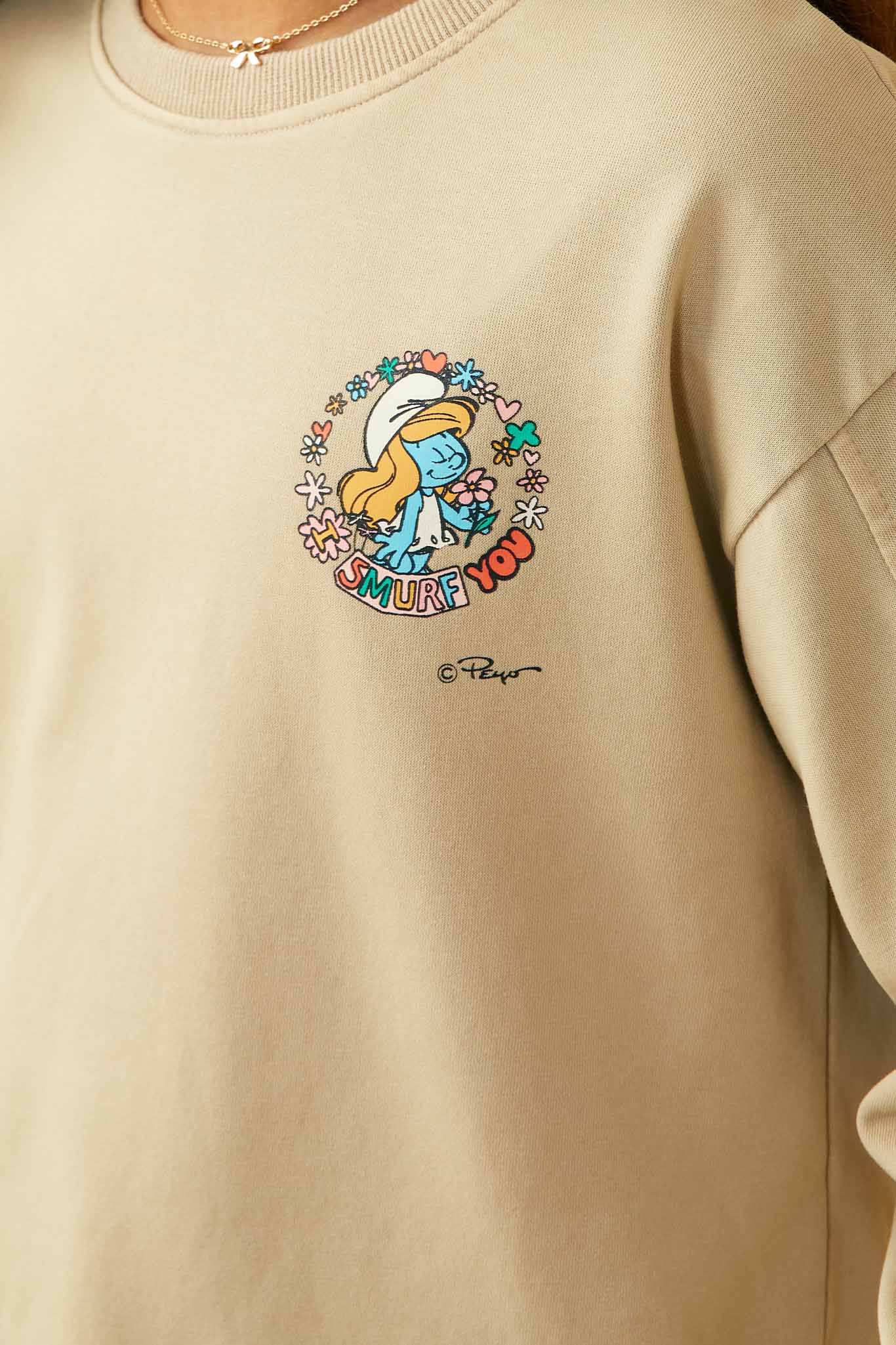 GS0040 Tan Smurfs All You Need is Love Graphic Garment Washed Sweatshirt Detail
