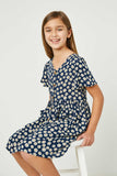 GY2706 Navy Girls Floral Flutter Sleeve Pocket Dress Sitting Pose