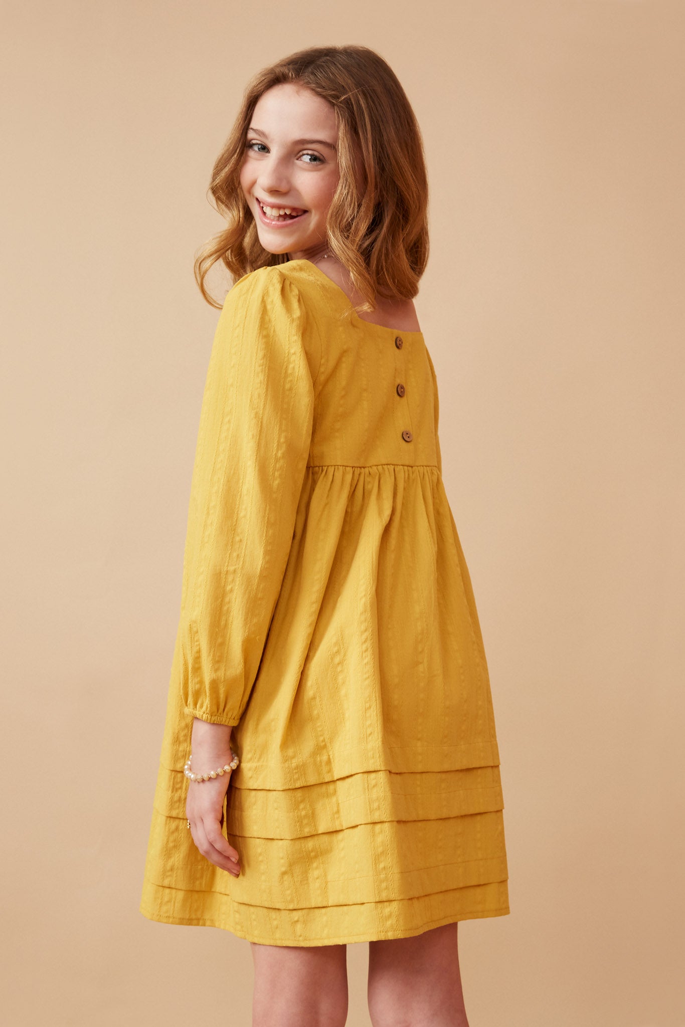 GY6606 Mustard Girls Square Neck Textured Stripe Pleat Detail Dress Back