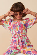 GY8032 Off White Girls Vivid Floral Self Belt Smocked Jumpsuit Pose