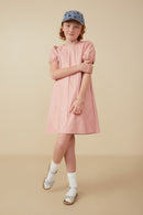GY8306 Blush Girls Puff Sleeve Pleat Detail Vegan Leather Dress Pose