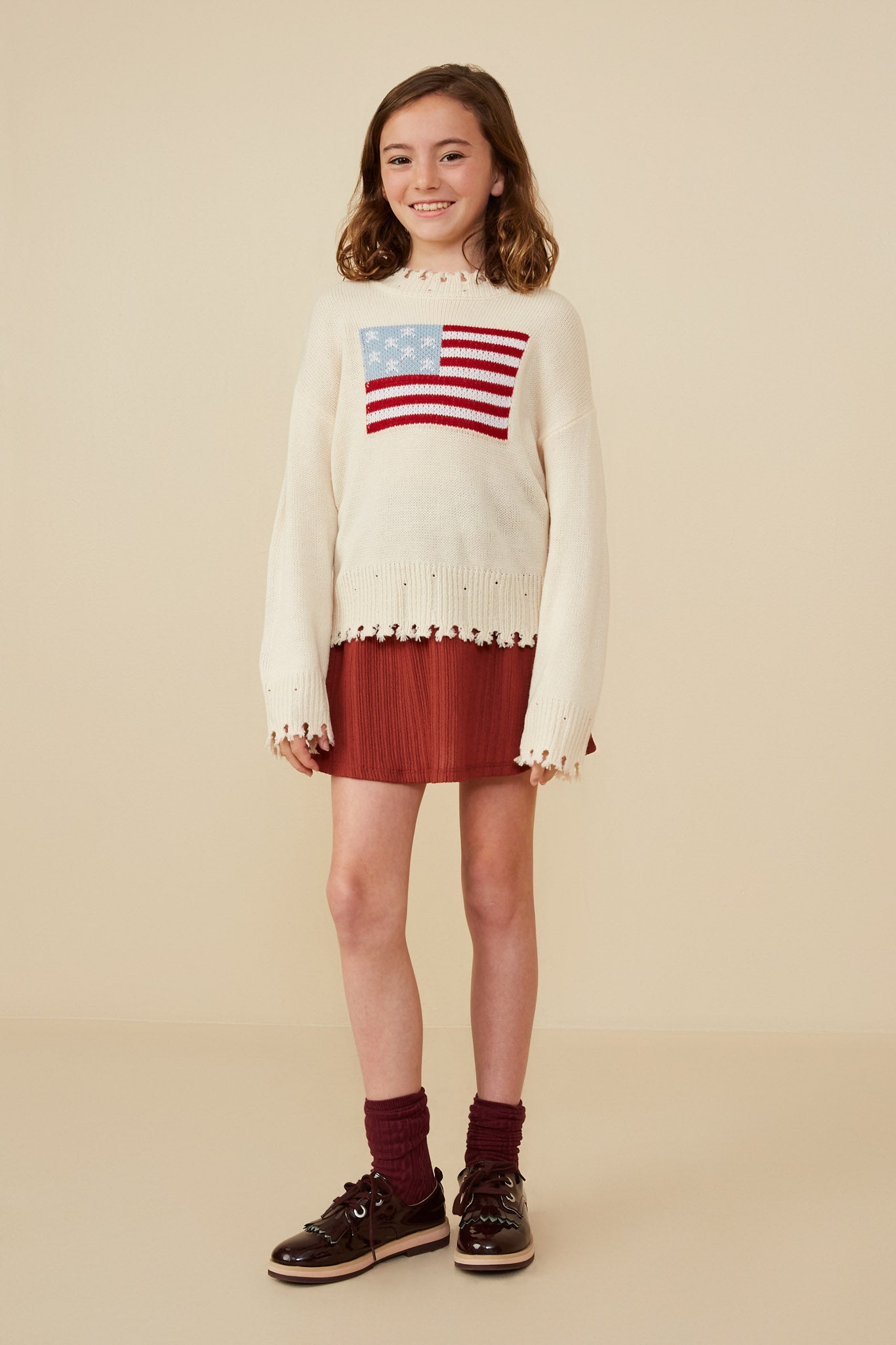 GY8614 Cream Girls Distressed Old Glory Graphic Sweater Pose