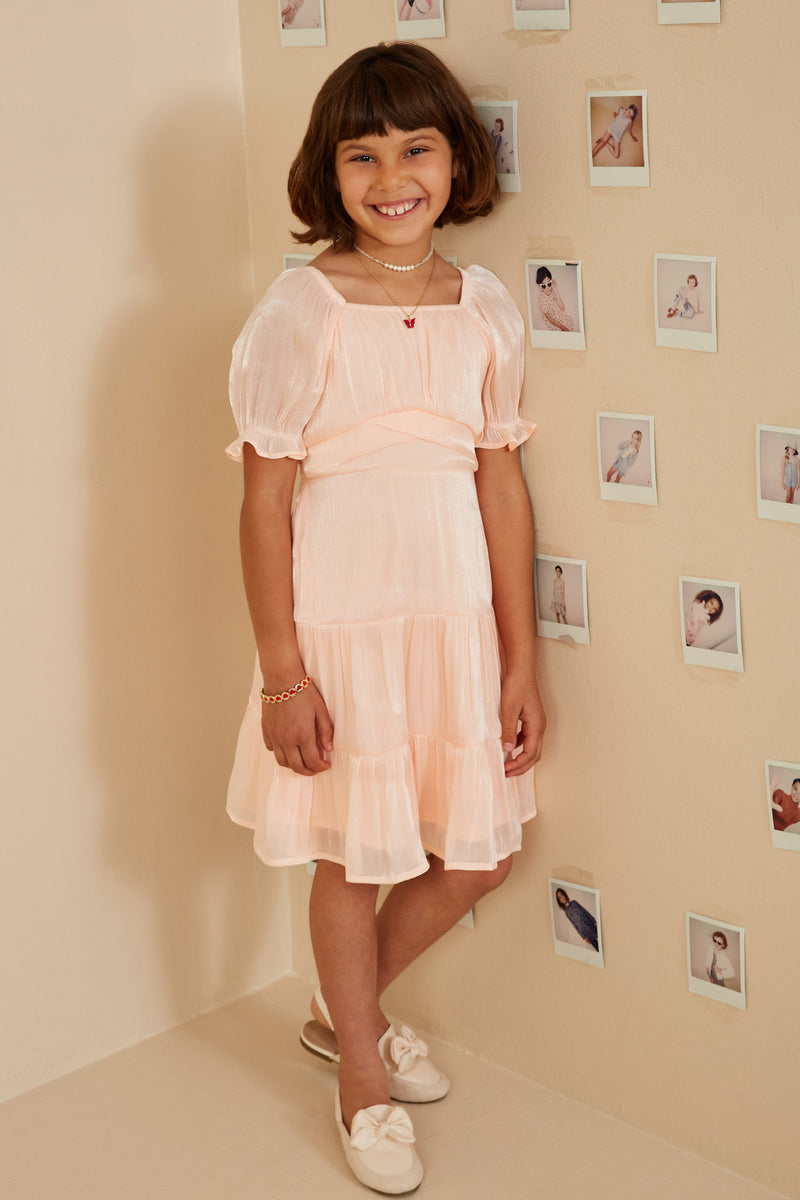 GY8623 Peach Girls Textured Shimmer Tie Detail Dress Pose