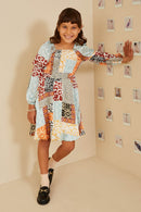 GY9057 Rust Mix Girls Quilted Animal Print Smocked Peasant Sleeve Dress Pose