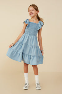 GY9180 Light Denim Girls Smocked Detail Ruffled Sleeveless Tencel Dress Pose