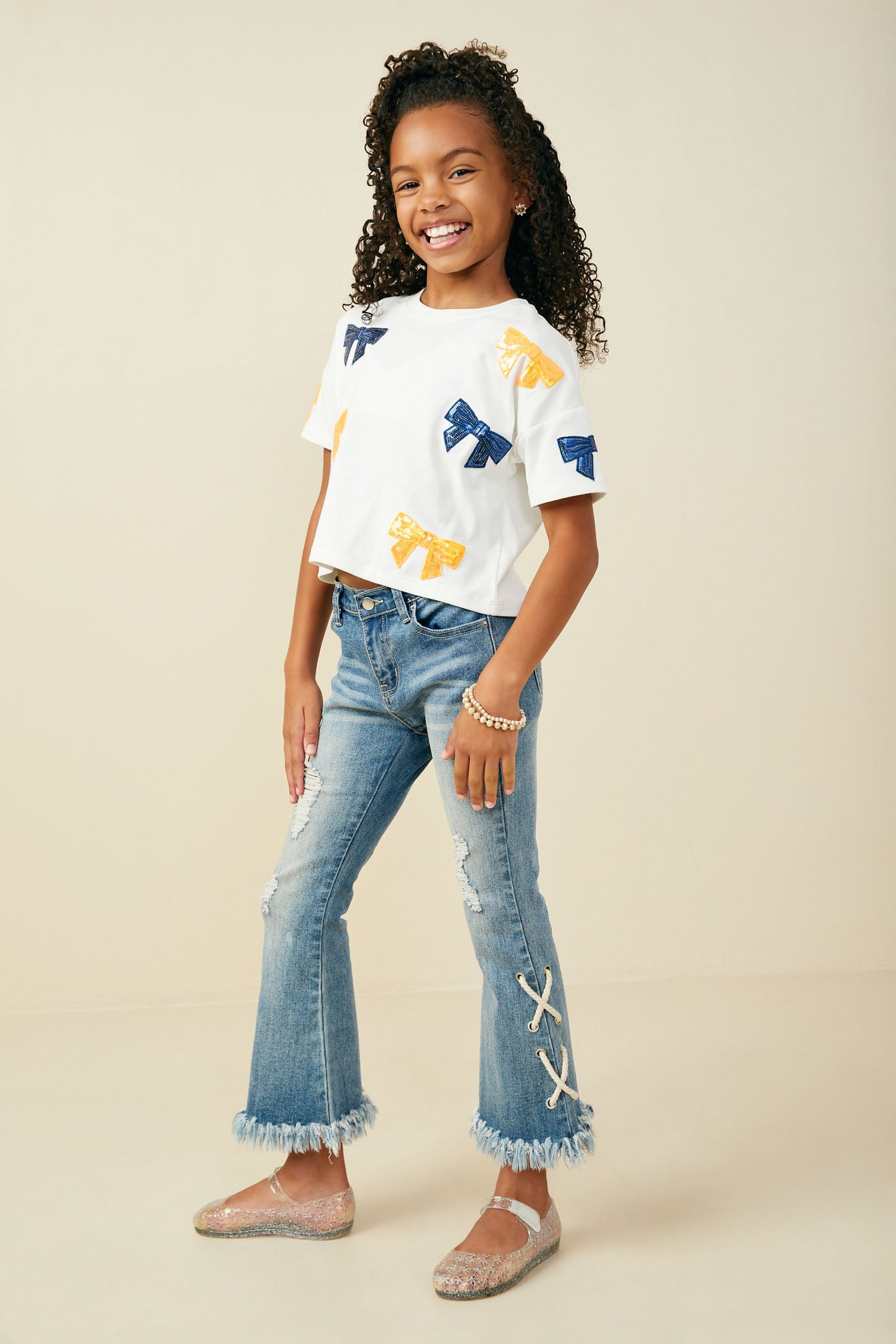 GY9583 ORANGE Girls Gameday Team Color Sequin Bow Patched T Shirt Pose