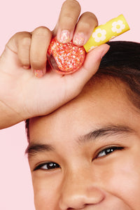 NPG001 Orange Confetti Hayden Girls Beauty Water Based Dazzling Nail Polish Product in Hand